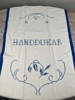 Handbroderad bonad 